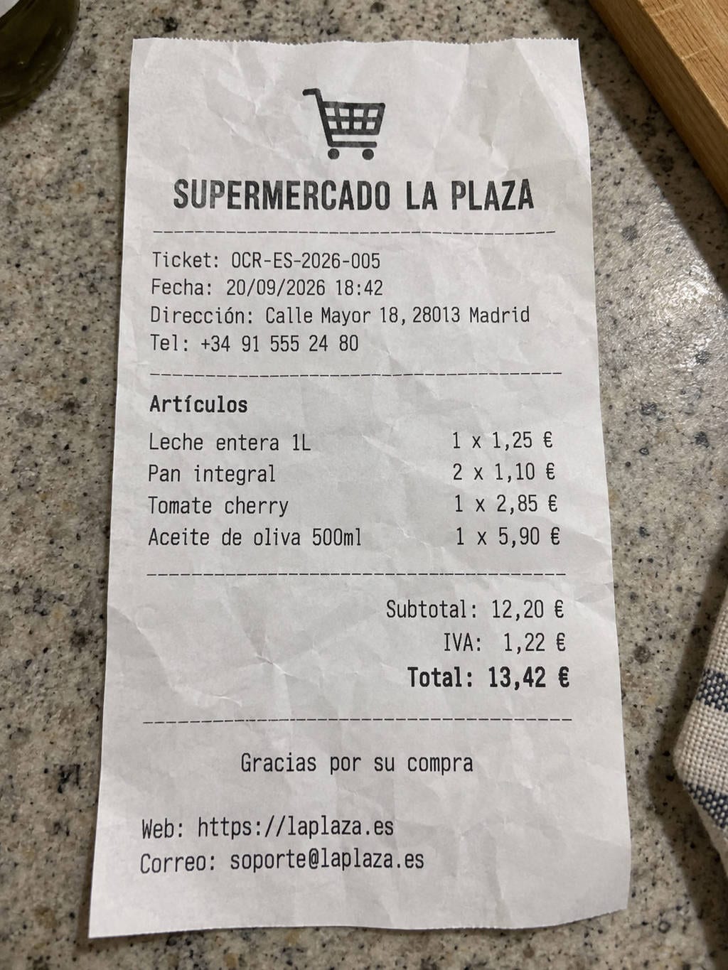 OCR-ES-2026-005 test fixture: Crumpled supermarket receipt